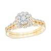 Thumbnail Image 0 of 0.36 CT. T.W. Diamond Cluster Flower Frame Bridal Set in 10K Gold