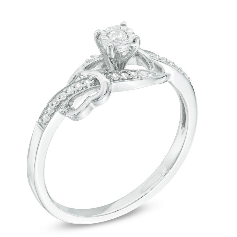0.09 CT. T.W. Diamond Bypass with Hearts Promise Ring in Sterling Silver