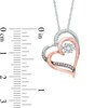 Thumbnail Image 1 of Unstoppable Love™ 0.09 CT. T.W. Champagne and White Diamond Tilted Heart Pendant in 10K Two-Tone Gold