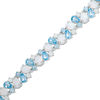 Thumbnail Image 1 of Pear-Shaped Blue Topaz, Lab-Created Opal and White Sapphire Bracelet in Sterling Silver - 7.25"