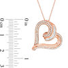 0.50 CT. T.W. Baguette and Round Diamond Tilted Heart Pendant in 10K Rose Gold