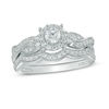 Thumbnail Image 0 of 0.58 CT. T.W. Diamond Frame Twist Bridal Set in 10K White Gold