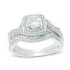 Thumbnail Image 1 of 5.0mm White Lab-Created Sapphire and 0.11 CT. T.W. Diamond Frame Twist Bridal Set in Sterling Silver
