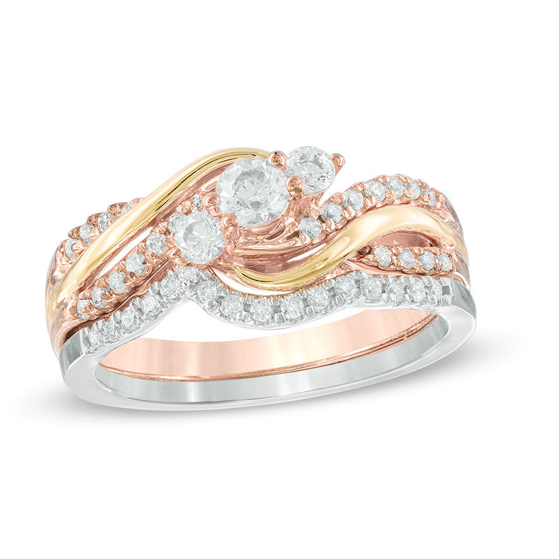 0.45 CT. T.W. Diamond Three Stone Bypass Bridal Set in 10K Tri-Tone Gold