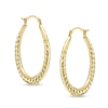 Thumbnail Image 0 of Ribbed Oval Hoop Earrings in Hollow 14K Gold