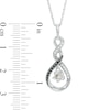 0.11 CT. T.W. Enhanced Black and White Diamond Swirling Infinity Flower Swirl Pendant in Sterling Silver and 10K Gold