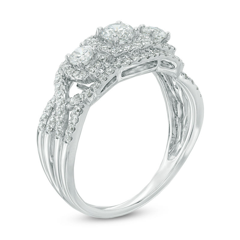 0.95 CT. T.W. Certified Canadian Diamond Three Stone Frame Engagement Ring in 14K White Gold (I/I2)