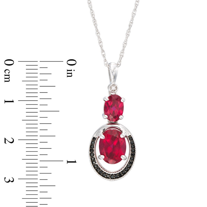 Oval Lab-Created Ruby and 0.09 CT. T.W. Enhanced Black and White Diamond Double Drop Pendant in 10K White Gold
