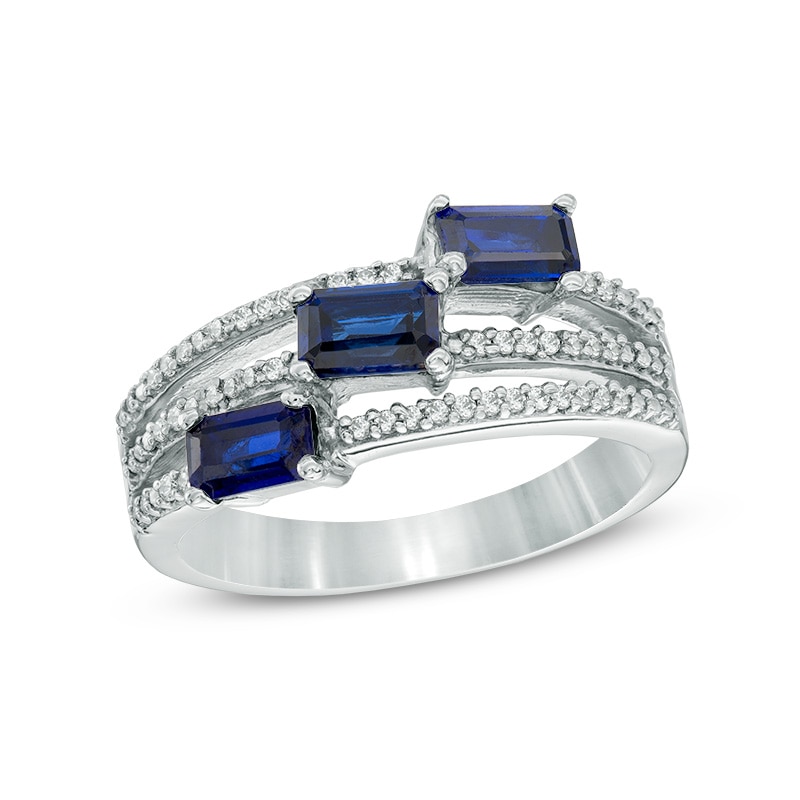 Emerald-Cut Lab-Created Blue Sapphire and 0.11 CT. T.W. Diamond Three Stone Slant Ring in Sterling Silver
