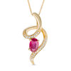 Thumbnail Image 0 of Oval Ruby and Diamond Accent Looping Ribbon Pendant in 10K Gold