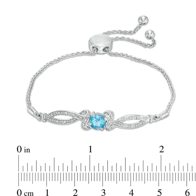 Peoples 6.0mm Blue Topaz and Diamond Accent Loop Bypass Bolo