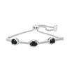 Thumbnail Image 1 of Oval Onyx and 0.09 CT. T.W. Diamond Three Stone Bar Bolo Bracelet in Sterling Silver - 9.5"