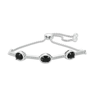 Oval Onyx and 0.09 CT. T.W. Diamond Three Stone Bar Bolo