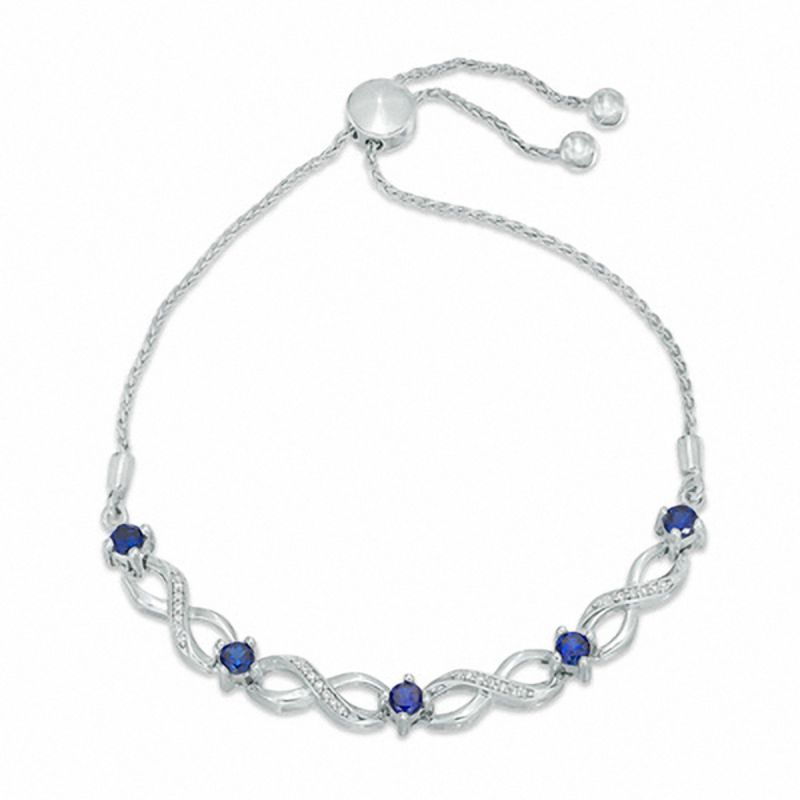 Lab-Created Blue Sapphire and 0.09 CT. T.W. Diamond Five Stone Infinity Bolo Bracelet in Sterling Silver - 9.5"|Peoples Jewellers