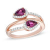 Thumbnail Image 0 of Pear-Shaped Rhodolite Garnet and Lab-Created White Sapphire Frame Bypass Ring in 10K Rose Gold