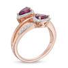 Thumbnail Image 1 of Pear-Shaped Rhodolite Garnet and Lab-Created White Sapphire Frame Bypass Ring in 10K Rose Gold