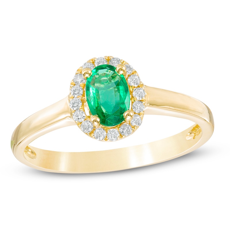 Oval Emerald and 0.11 CT. T.W. Diamond Frame Ring in 10K Gold