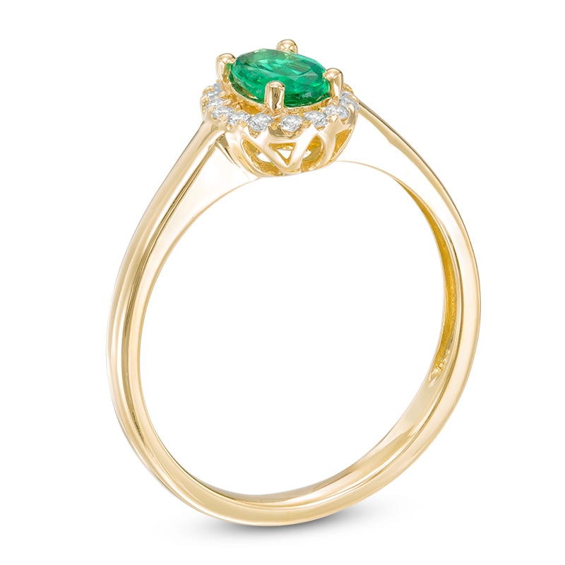 Oval Emerald and 0.11 CT. T.W. Diamond Frame Ring in 10K Gold
