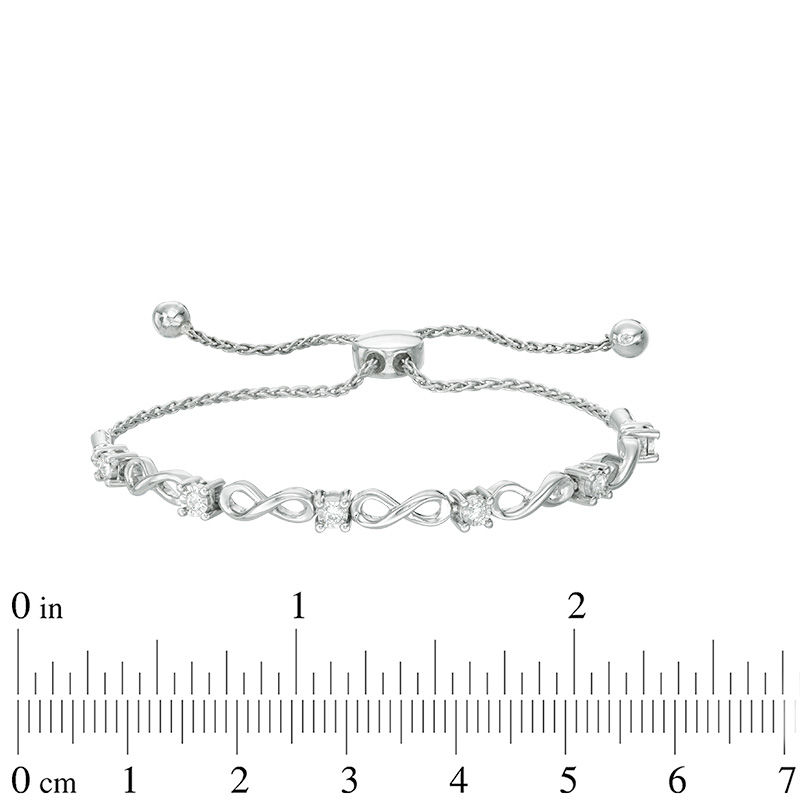0.16 CT. T.W. Diamond Infinity Bolo Bracelet in 10K White Gold - 9.5"