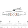 Thumbnail Image 1 of 0.11 CT. T.W. Diamond Intertwining Heart Bolo Bracelet in Sterling Silver and 10K Rose Gold - 9.5"