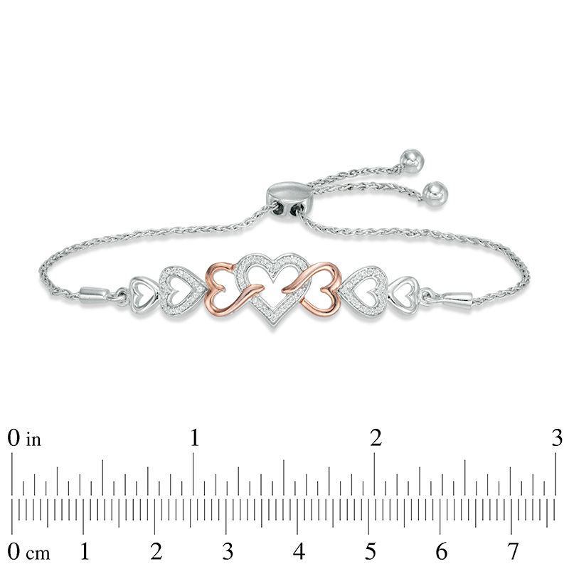 0.11 CT. T.W. Diamond Intertwining Heart Bolo Bracelet in Sterling Silver and 10K Rose Gold - 9.5"