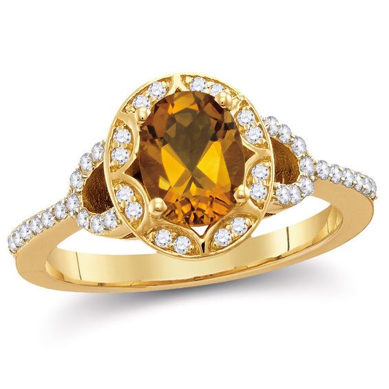 Oval Citrine and 0.25 CT. T.W. Diamond Frame Buckle Ring in 10K Gold Oval Citrine and 0.25 CT. T.W. Diamond Frame Buckle Ring in 10K Gold