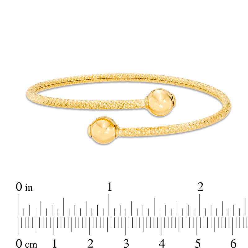 Italian Gold Diamond-Cut Bypass Flex Bangle in 14K Gold - 7.5"