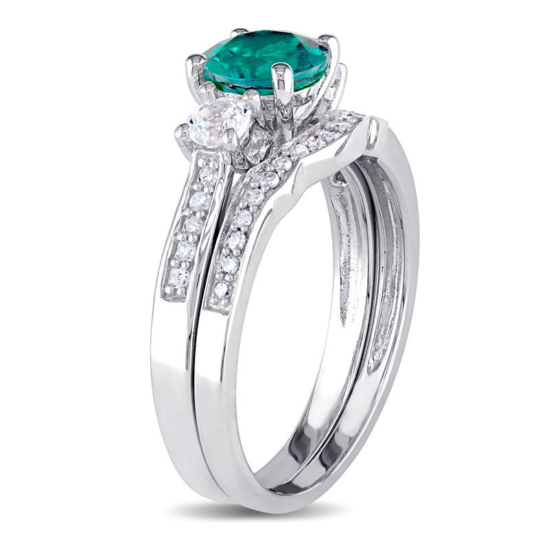 Main Image 2 of 6.0mm Lab-Created Emerald and White Sapphire with 0.14 CT. T.W. Diamond Three Stone Bridal Set in 10K White Gold