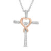 Thumbnail Image 0 of Unstoppable Love™ 0.12 CT. T.W. Diamond Heart Wrapped Cross Pendant in 10K Two-Tone Gold
