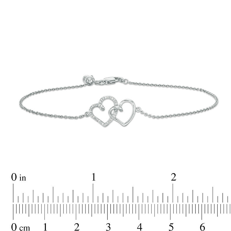 0.04 CT. T.W. Diamond Interlocking Hearts Bracelet in Sterling Silver - 6.75"|Peoples Jewellers