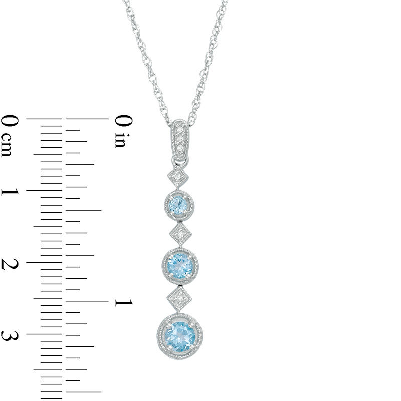 Main Image 2 of Blue Topaz and Diamond Accent Graduating Three Stone Vintage-Style Pendant in 10K White Gold