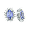 Thumbnail Image 0 of Oval Tanzanite and 0.16 CT. T.W. Diamond Starburst Frame Stud Earrings in Sterling Silver