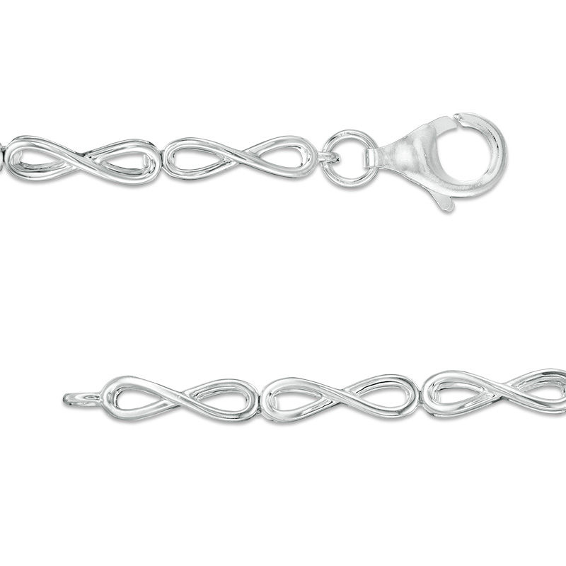 Main Image 2 of Oval White Lab-Created Sapphire Sunburst Frame and Infinity Link Bracelet in Sterling Silver - 7.5"
