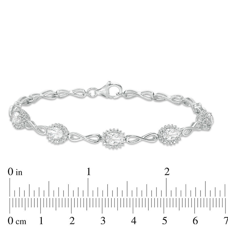 Oval White Lab-Created Sapphire Sunburst Frame and Infinity Link Bracelet in Sterling Silver - 7.5"