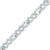 Thumbnail Image 0 of Oval Aquamarine and Diamond Accent Heart-Shaped Infinity Bracelet in Sterling Silver - 7.25"