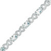 Oval Aquamarine and Diamond Accent Heart-Shaped Infinity Bracelet in Sterling Silver - 7.25"