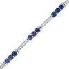 3.5mm Lab-Created Blue Sapphire and 0.18 CT. T.W. Diamond Three Stone Station Bracelet in Sterling Silver - 7.5"