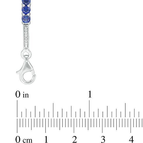 3.5mm Lab-Created Blue Sapphire and 0.18 CT. T.W. Diamond Three Stone Station Bracelet in Sterling Silver - 7.5"