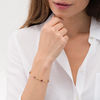 Thumbnail Image 2 of Oval Garnet and Diamond Accent Bracelet in Sterling Silver with 10K Gold Plate - 7.25"