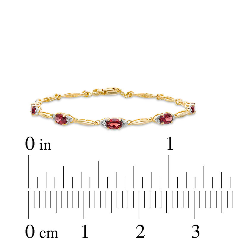Main Image 4 of Oval Garnet and Diamond Accent Bracelet in Sterling Silver with 10K Gold Plate - 7.25"