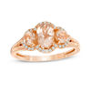 Thumbnail Image 1 of Oval Morganite and 0.12 CT. T.W. Diamond Frame Three Stone Ring in 10K Rose Gold