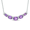 Oval Amethyst and 0.09 CT. T.W. Diamond Graduated Five Stone Necklace in Sterling Silver