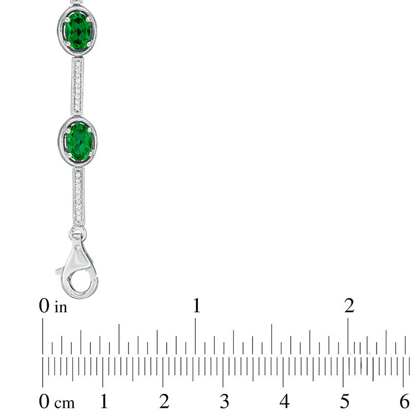 Oval Lab-Created Emerald and 0.23 CT. T.W. Diamond Station Bracelet in Sterling Silver - 7.5"