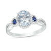 Thumbnail Image 1 of Oval Aquamarine with Lab-Created Blue and White Sapphire Frame Twist Shank Ring in 10K White Gold