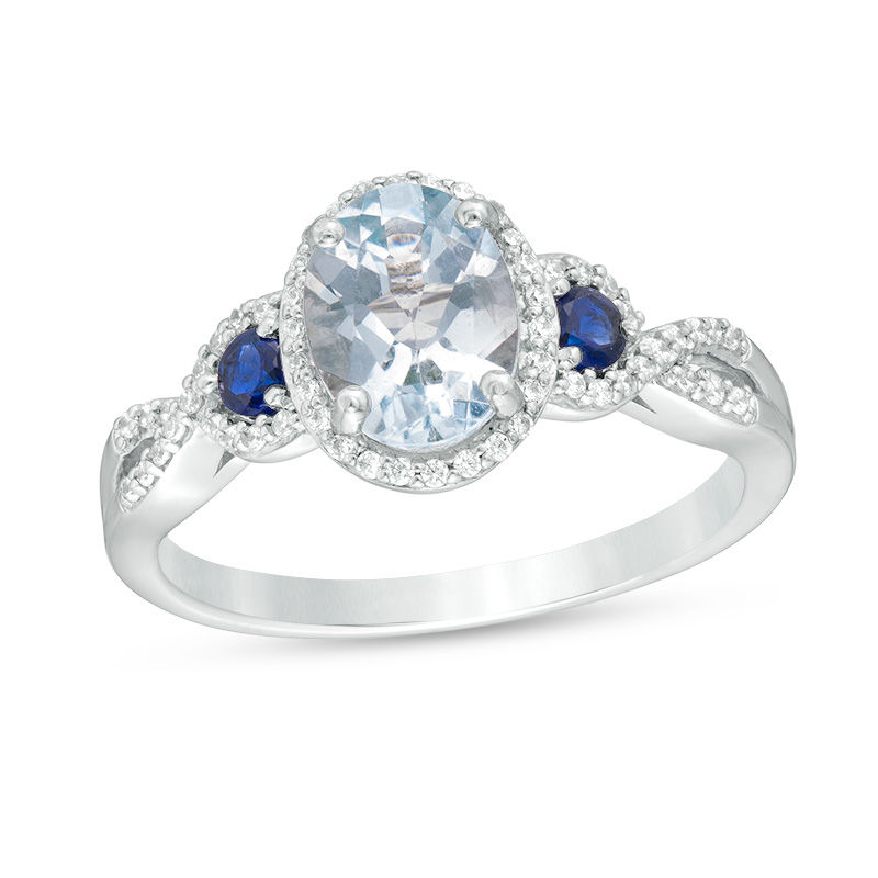 Oval Aquamarine with Lab-Created Blue and White Sapphire Frame Twist Shank Ring in 10K White Gold