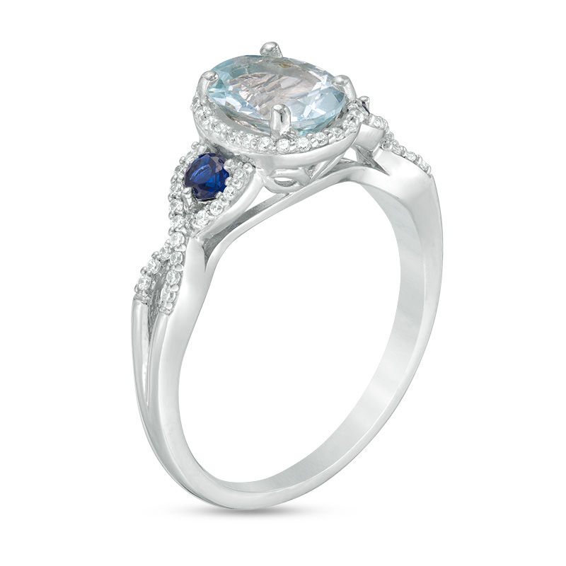 Oval Aquamarine with Lab-Created Blue and White Sapphire Frame Twist Shank Ring in 10K White Gold