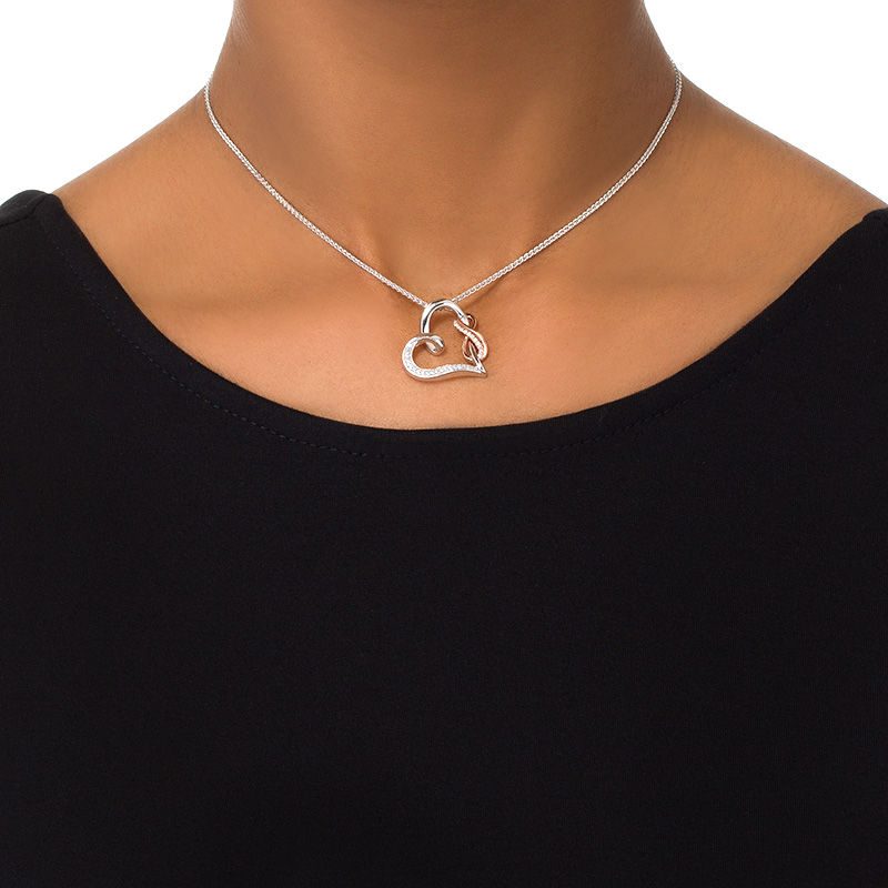 0.11 CT. T.W. Diamond Tilted Heart with Infinity Bolo Necklace in Sterling Silver and 10K Rose Gold - 30"