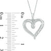 0.25 CT. T.W. Baguette and Round Diamond Heart Pendant in 10K White Gold