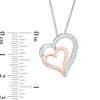 0.09 CT. T.W. Diamond Tilted Double Heart Pendant in Sterling Silver and 10K Rose Gold