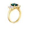 Thumbnail Image 1 of Emerald-Cut Lab-Created Emerald and White Topaz Three Stone Ring in 10K Gold